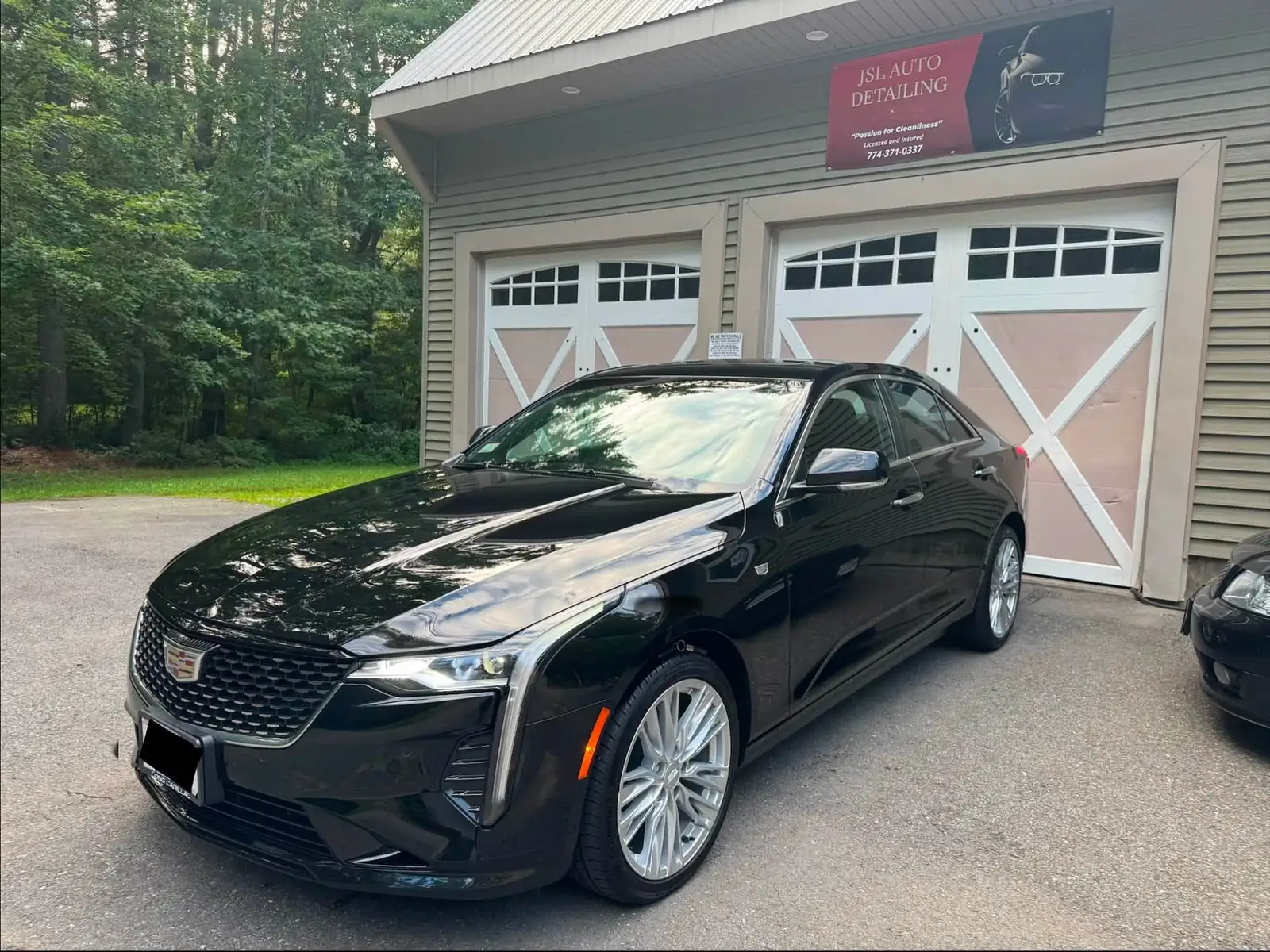 Black Cadillac CT4 outside the JSL Auto Detailing shop in Rutland
