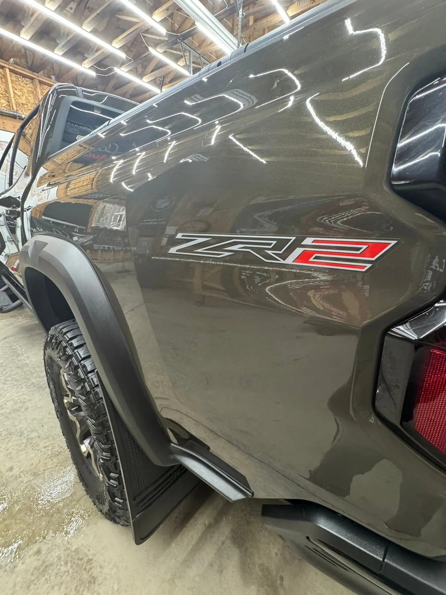 The same Colorado ZR2 clean, with the shop lights reflected in the paint