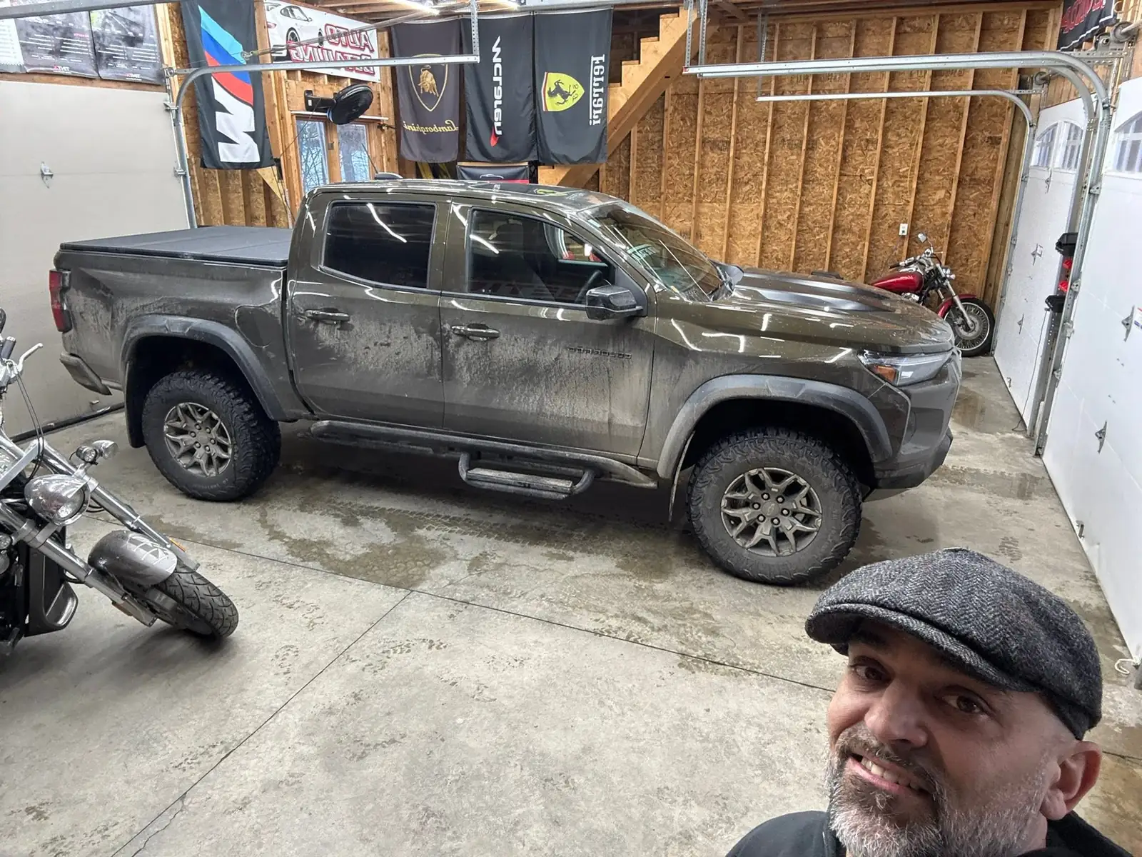 Jason with the muddy Chevy Colorado ZR2 in his shop