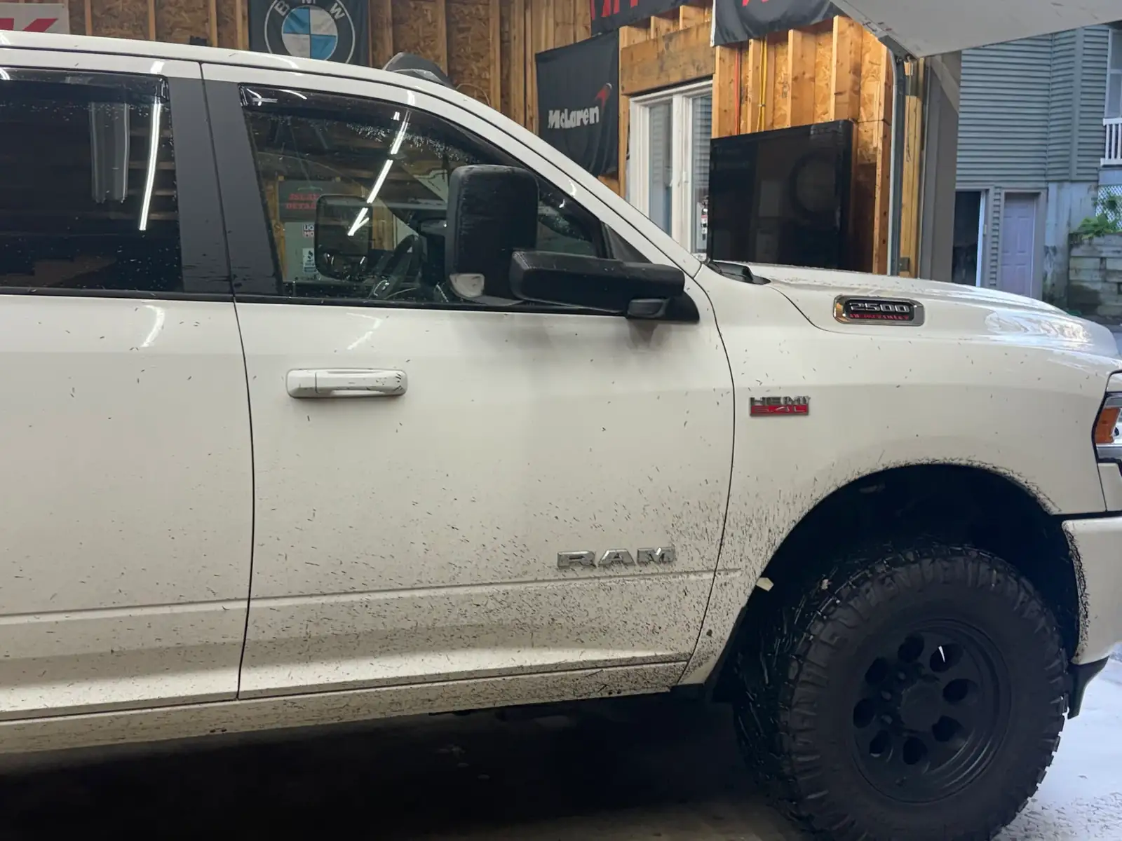 Mud spattered on the white Ram's front door, before