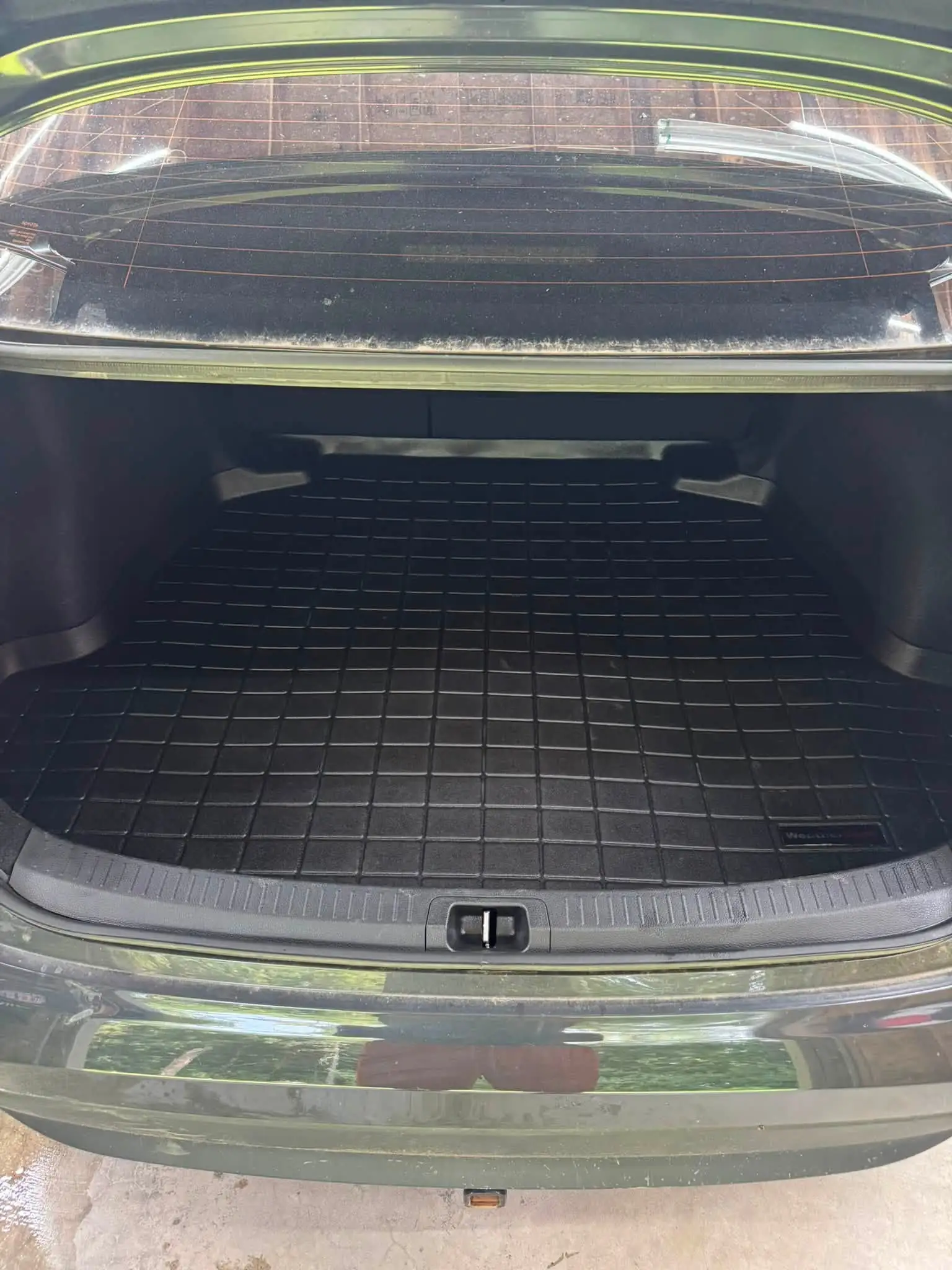 A clean black trunk liner, after